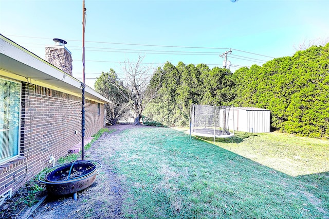 1500 Nugent St, Bowie, TX 76230 - view of green lawn with a trampoline