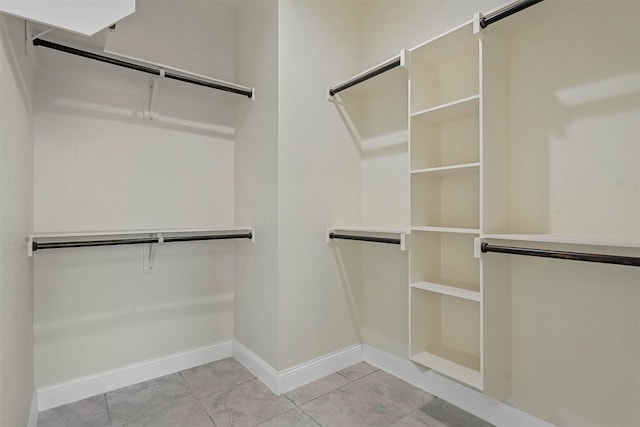 walk in closet featuring light tile patterned floors