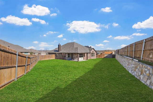 view of yard featuring a fenced backyard and a patio