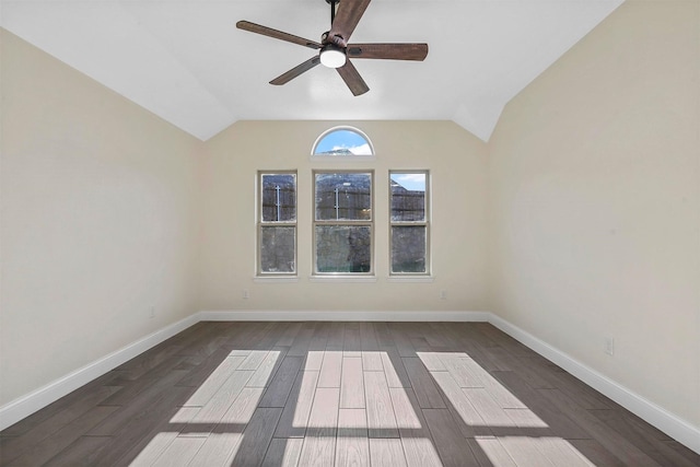 unfurnished room with wood tiled floor, lofted ceiling, and baseboards