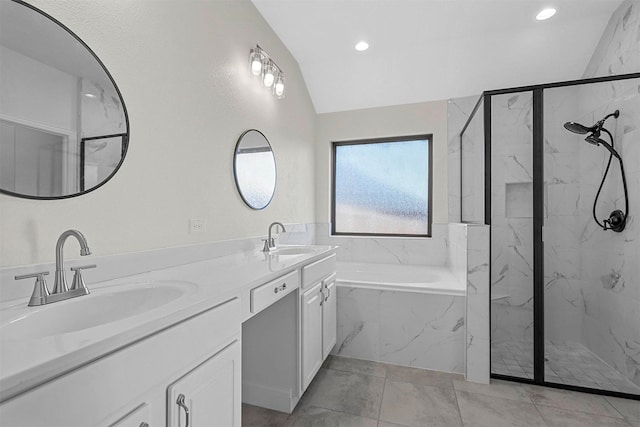 full bath with lofted ceiling, a sink, a marble finish shower, and a bath