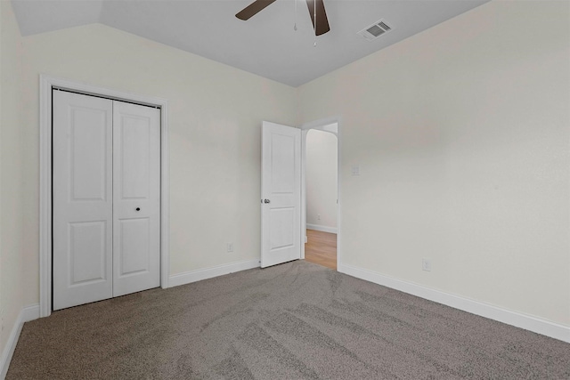 unfurnished bedroom with visible vents, baseboards, a ceiling fan, carpet flooring, and a closet