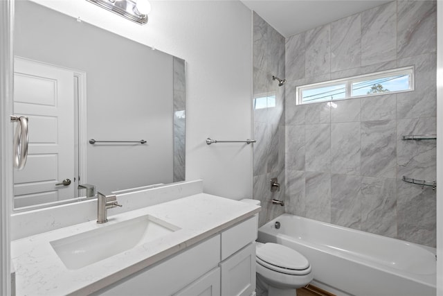 bathroom with shower / washtub combination, vanity, and toilet