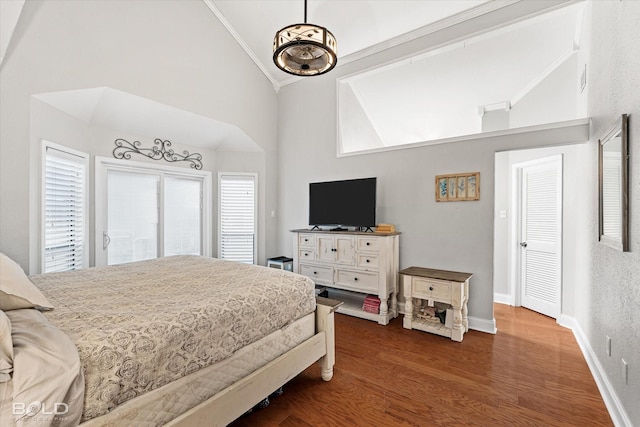 bedroom with access to exterior, high vaulted ceiling, wood finished floors, and baseboards