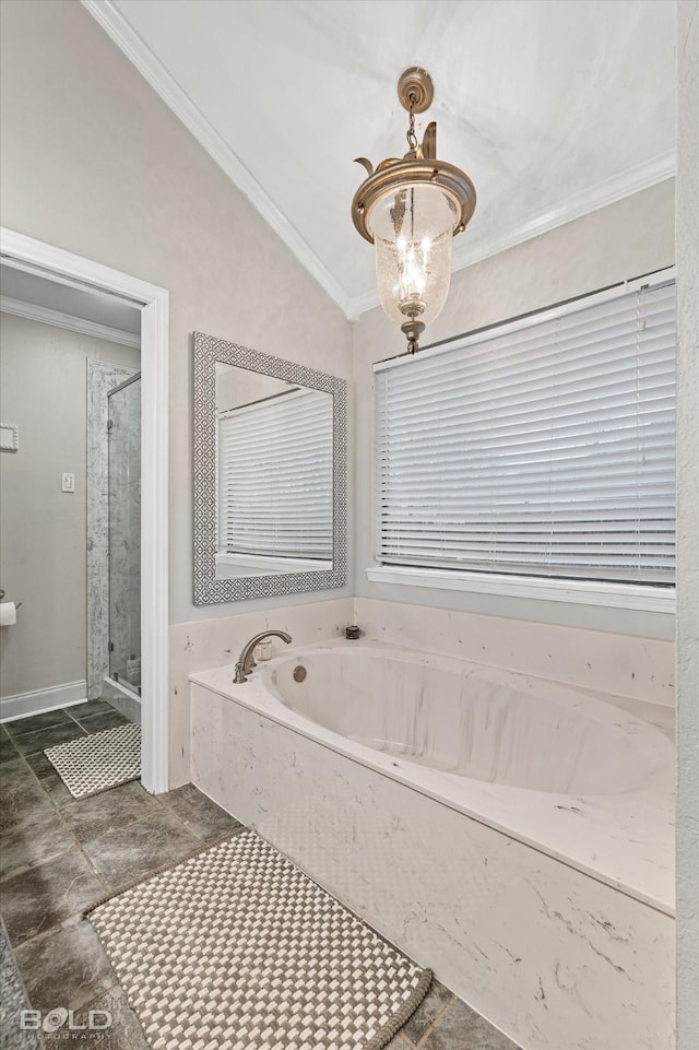 bathroom with a stall shower, lofted ceiling, ornamental molding, a chandelier, and a bath