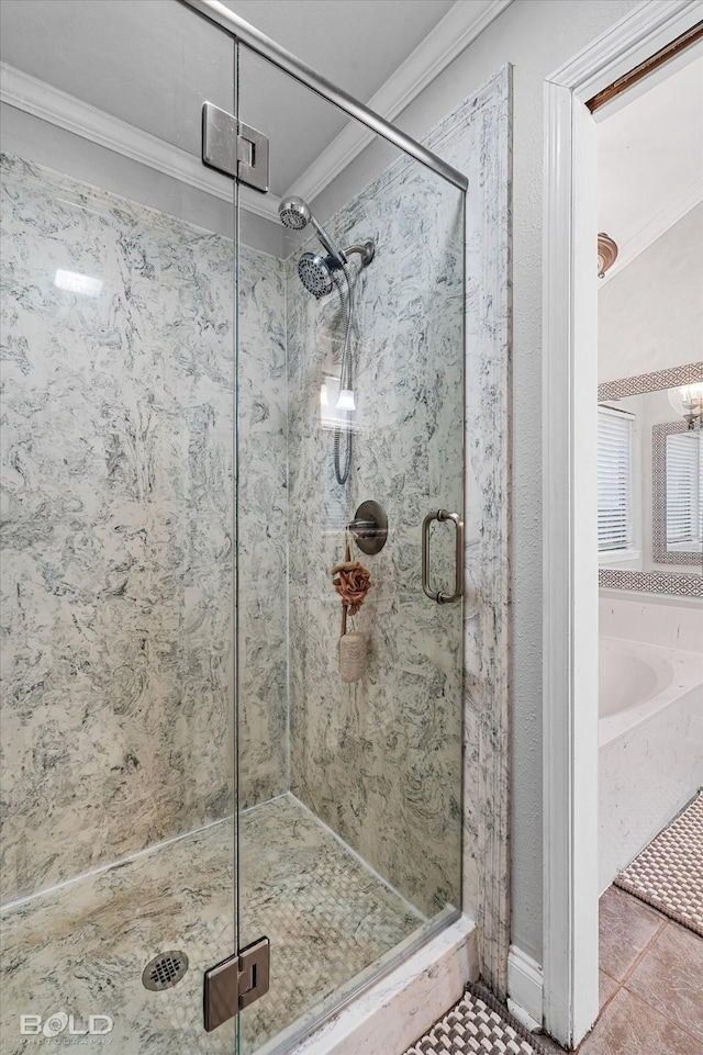 bathroom featuring ornamental molding, tile patterned floors, a shower stall, and a bath