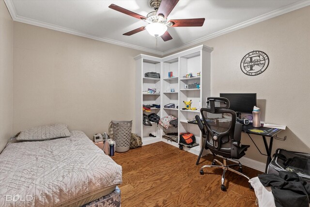 bedroom featuring ornamental molding, a ceiling fan, baseboards, and wood finished floors