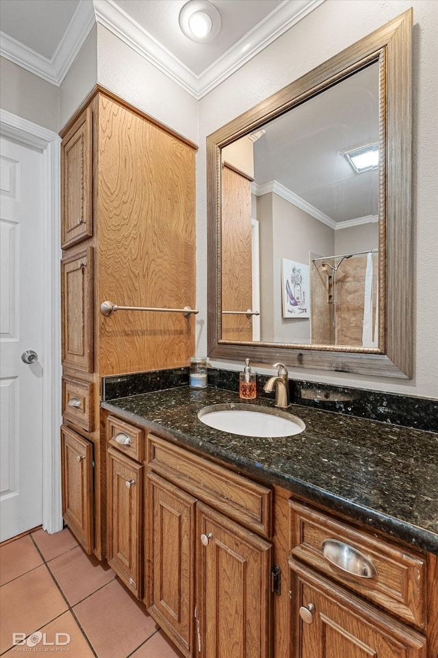 bathroom featuring crown molding, vanity, and tile patterned floors