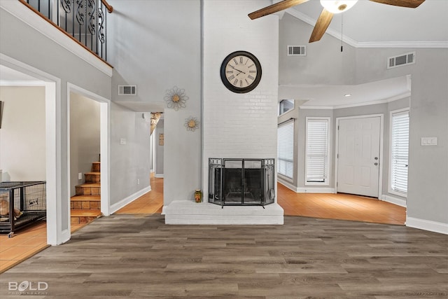 living area featuring wood finished floors and visible vents