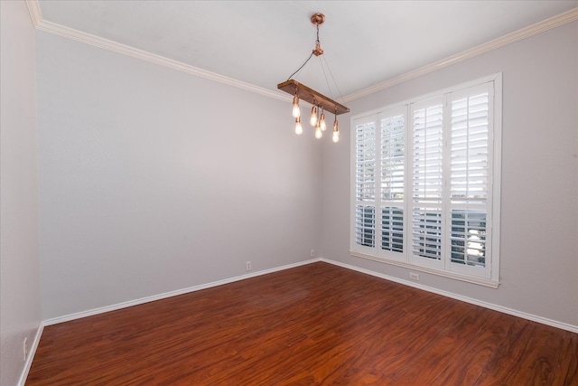 empty room featuring dark wood-style floors, baseboards, and crown molding