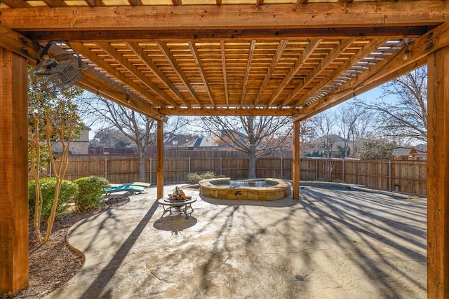 view of patio with a fire pit, a fenced backyard, and a pergola