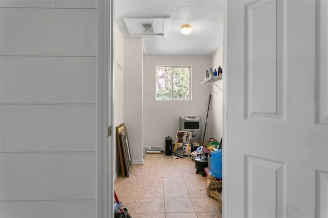 laundry room featuring light tile patterned flooring