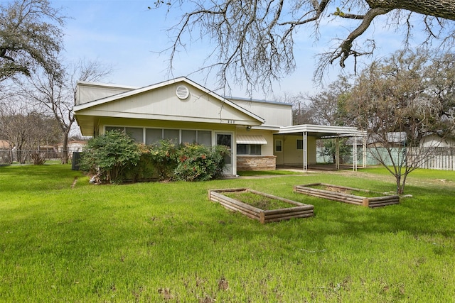 back of house with fence and a lawn