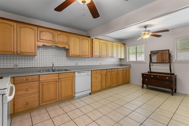 kitchen featuring light tile patterned floors, white appliances, a sink, a ceiling fan, and backsplash