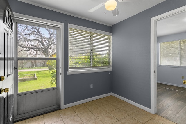 doorway featuring a healthy amount of sunlight and baseboards