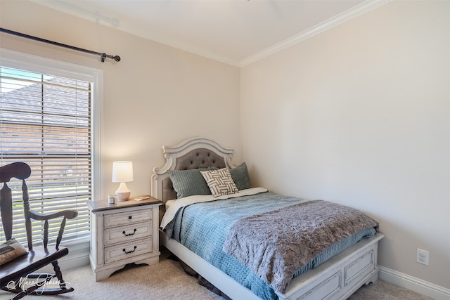 bedroom with light carpet, baseboards, and ornamental molding