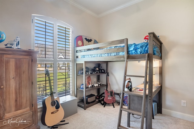 carpeted bedroom with crown molding and baseboards