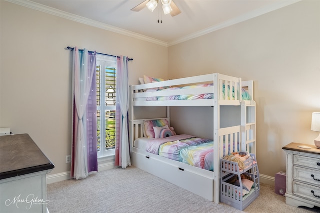 bedroom with ornamental molding, carpet flooring, and baseboards