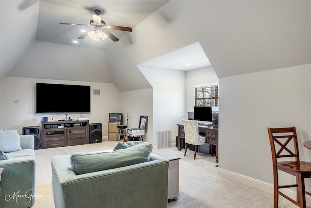 living area with light colored carpet, visible vents, a ceiling fan, vaulted ceiling, and baseboards