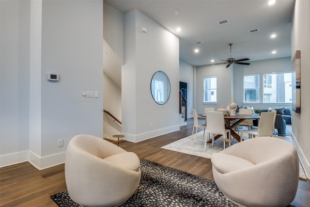 dining space featuring baseboards, visible vents, wood finished floors, and recessed lighting