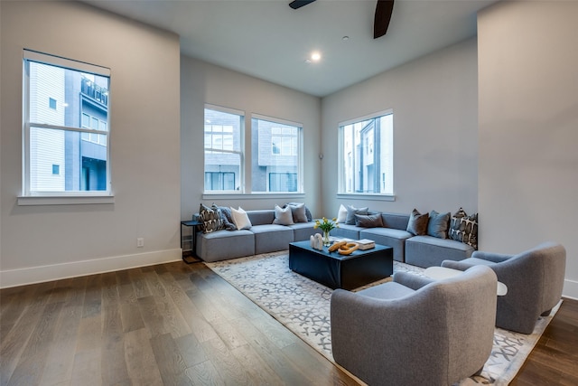 living area with ceiling fan, recessed lighting, dark wood finished floors, and baseboards