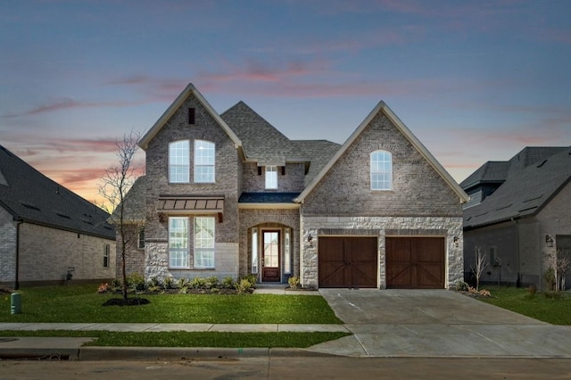 view of front of house featuring concrete driveway, brick siding, a front lawn, and a shingled roof