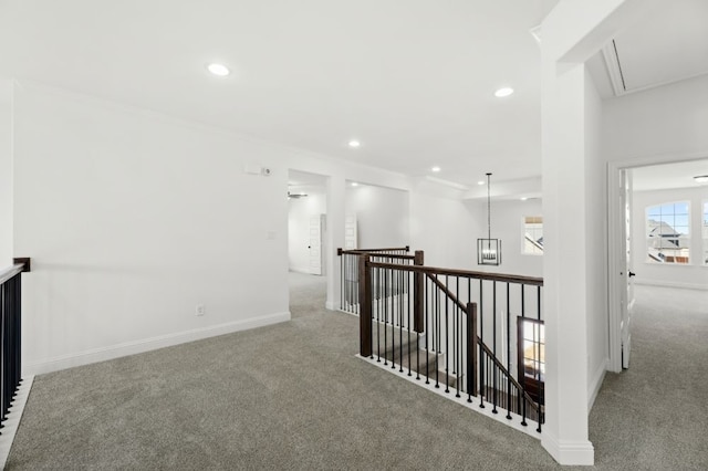 hallway featuring an upstairs landing, carpet flooring, attic access, and recessed lighting