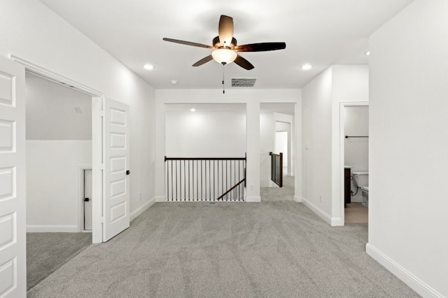 carpeted spare room featuring recessed lighting, visible vents, ceiling fan, and baseboards