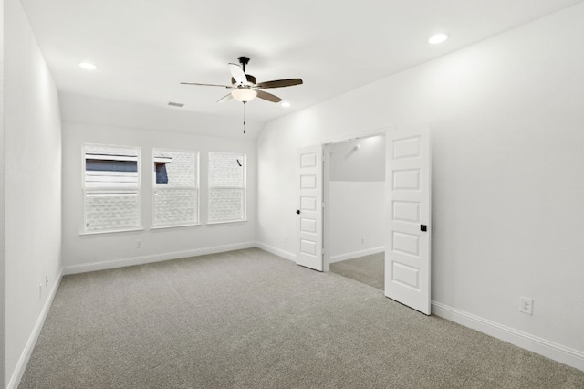 carpeted empty room with recessed lighting, a ceiling fan, and baseboards