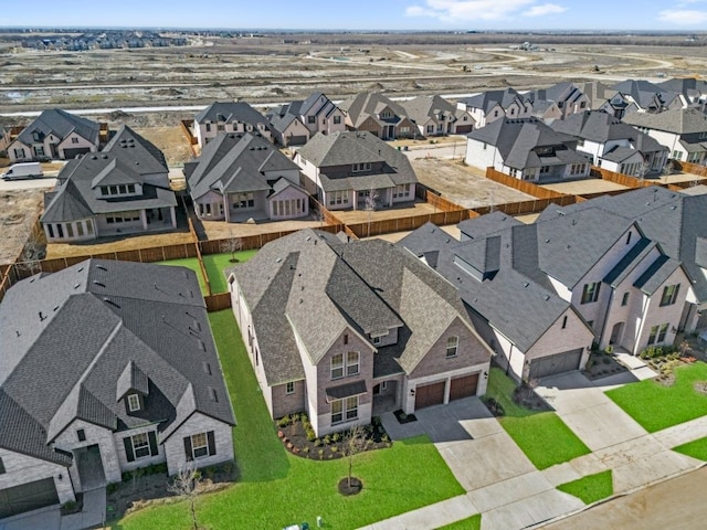 birds eye view of property with a residential view