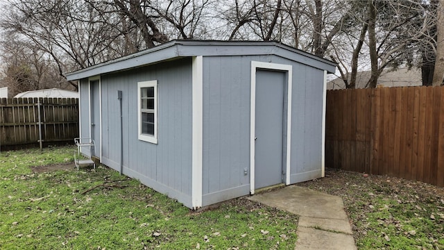 view of shed featuring a fenced backyard