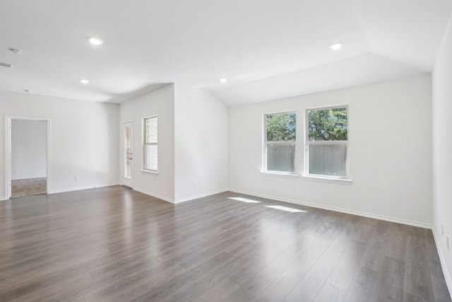 unfurnished room featuring vaulted ceiling, baseboards, dark wood finished floors, and recessed lighting