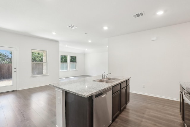 kitchen featuring dark wood-style flooring, visible vents, a sink, and stainless steel dishwasher