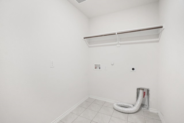 washroom with light tile patterned floors, laundry area, gas dryer hookup, hookup for a washing machine, and hookup for an electric dryer