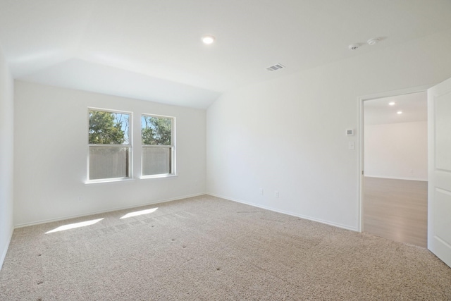 unfurnished room with recessed lighting, baseboards, visible vents, and carpet flooring