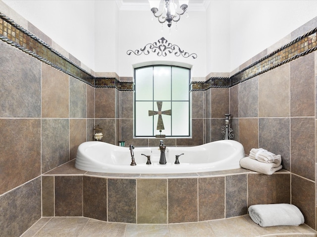 bathroom with ornamental molding, a garden tub, and tile walls