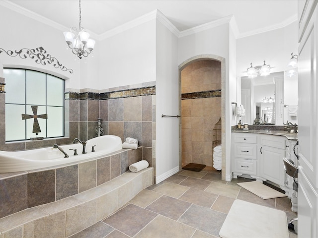 bathroom featuring ornamental molding, a garden tub, vanity, a walk in shower, and a notable chandelier