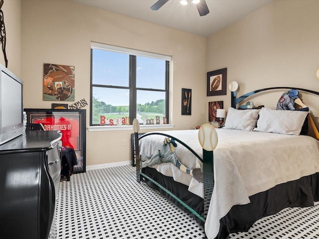 bedroom featuring a ceiling fan and baseboards