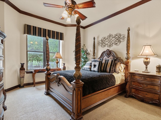 carpeted bedroom with baseboards, ceiling fan, and crown molding