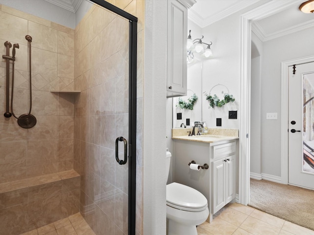 bathroom with toilet, vanity, ornamental molding, a shower stall, and tile patterned floors