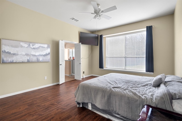 bedroom featuring ceiling fan, wood finished floors, visible vents, and baseboards