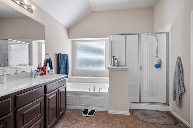 full bathroom with vaulted ceiling, a stall shower, tile patterned flooring, and vanity