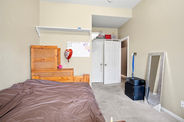 bedroom featuring carpet floors and baseboards