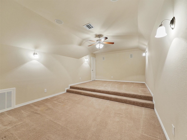 bonus room featuring baseboards, visible vents, and carpet flooring