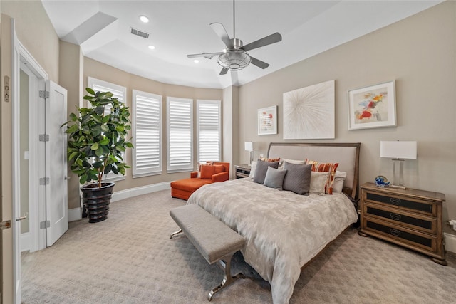 carpeted bedroom with ceiling fan, recessed lighting, visible vents, and baseboards