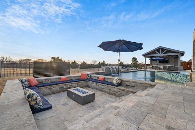 view of pool with a fire pit, a patio area, fence, and a fenced in pool