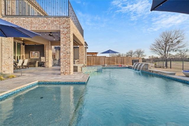 view of pool with a ceiling fan, a fenced in pool, a patio area, and fence