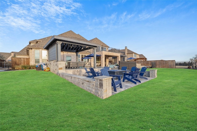 view of yard featuring a fire pit, a gazebo, a patio, and a fenced backyard