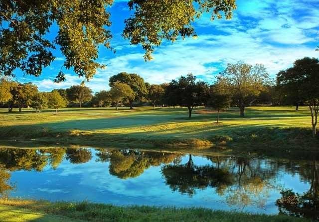 surrounding community with a water view and a yard