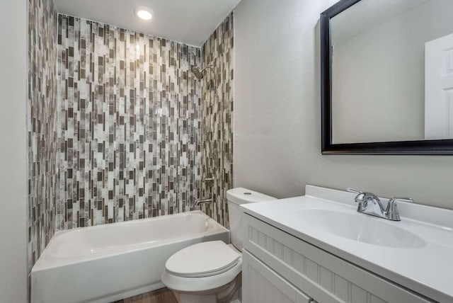 bathroom with toilet, recessed lighting, washtub / shower combination, and vanity